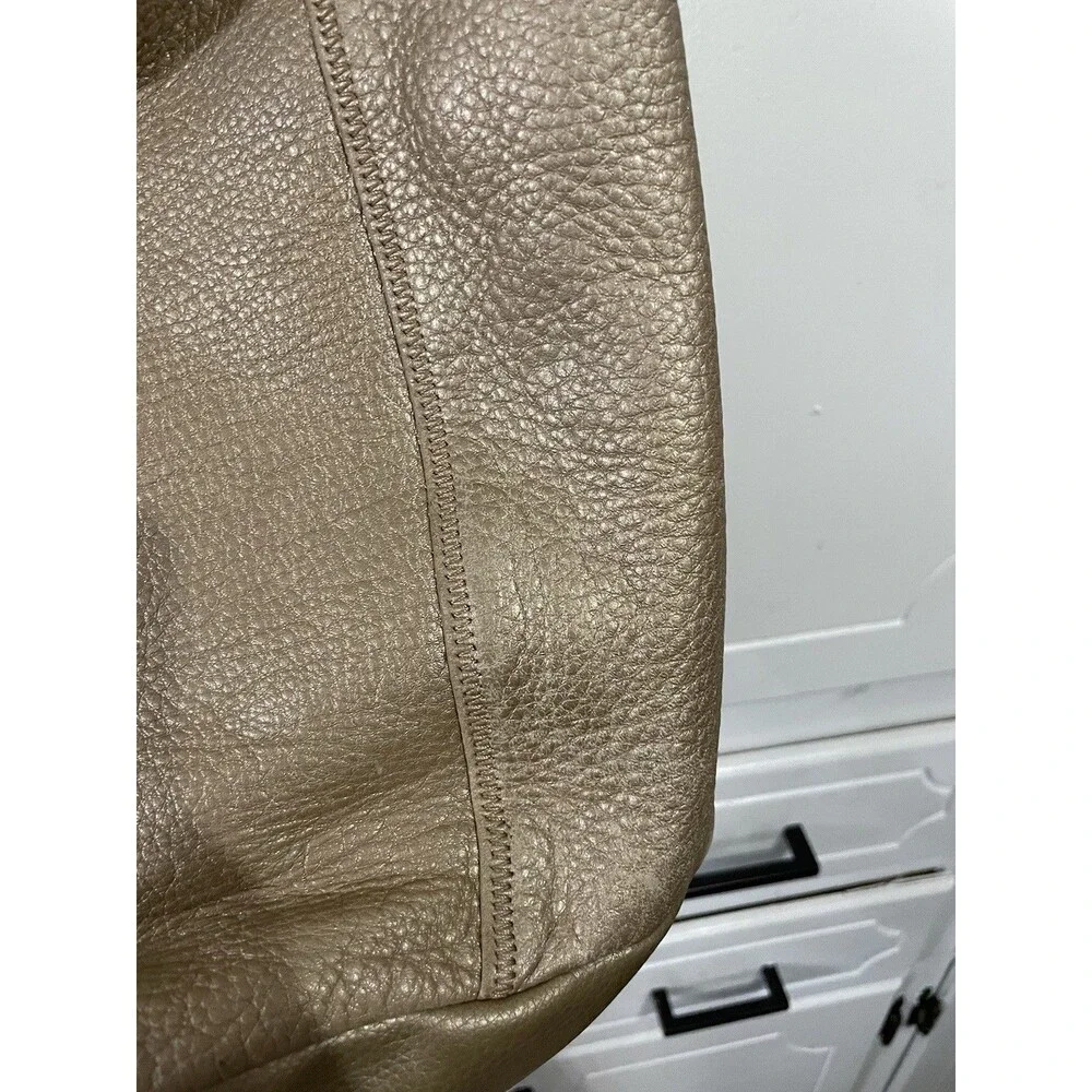The SAK Gold Pebbled Leather Hobo Shoulder Bag Purse Single Strap Handbag
